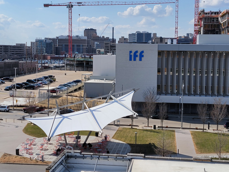 Cortex_IFF_building_on_Boyle_ave,_Commons_shade_structure_with_construction_of_the_Neuro_Science_building_west_view_2022.jpg